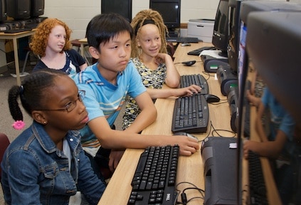 Students working on a computer.