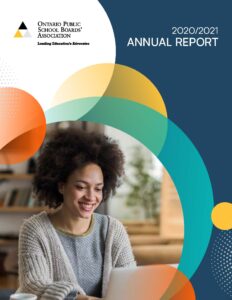 The cover of the 2020-21 OPSBA Annual Report featuring a smiling woman at work on a laptop computer.