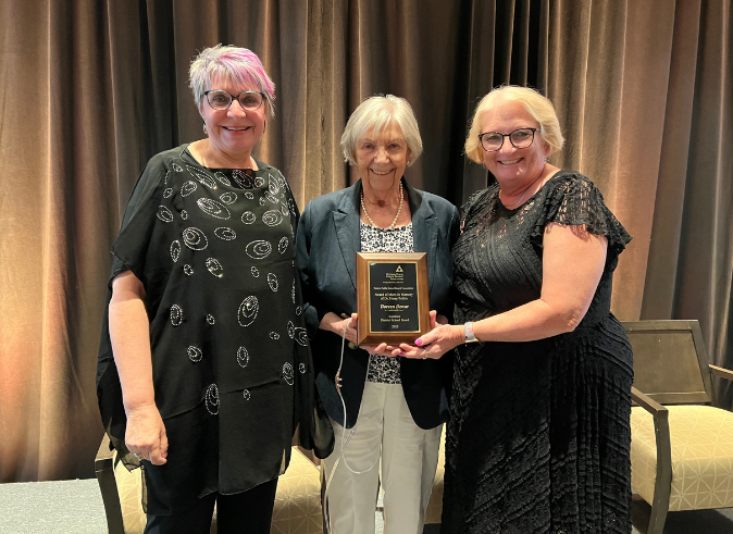 Rainbow DSB Trustee Doreen Dewar (centre) receives the Dr. Harry Paikin Award at the 2023 OPSBA AGM. She is flanked by OPSBA President Cathy Abraham (R) and Rainbow DSB Trustee Judy Kosmerly.